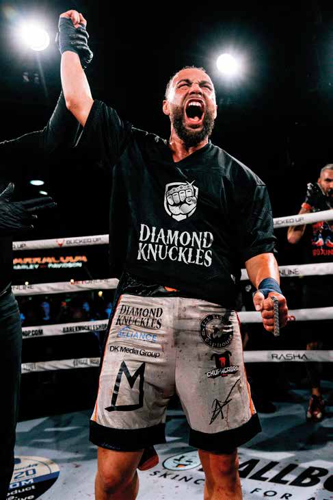 Quentin "QG" Gaskins celebrating his BKFC knockout victory in the ring